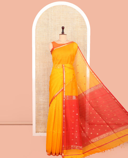 Yellow Maheshwari Cotton Saree, Adorned With Buttas All Over Its Body, Complemented by Suble Contrast Piping Border,  Pallu of Buttas and Paired with a Contrast Blouse