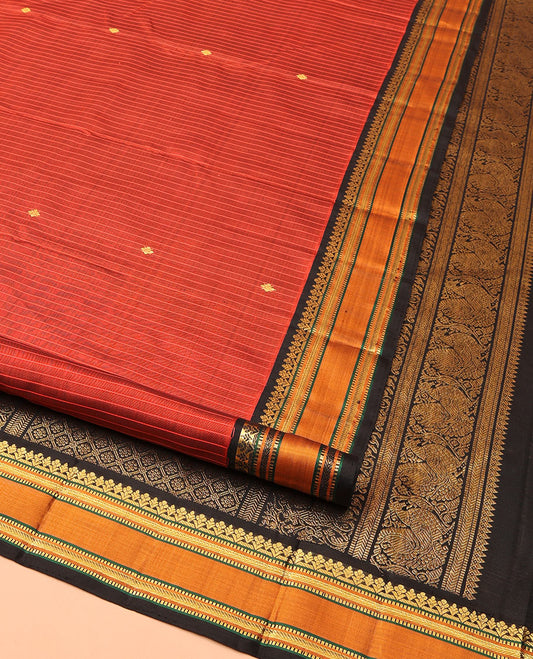 Orange Kanchipuram Silk Saree, Decked Up with Zari Buttas and Stripes All Over Its Body, Complemented by Contrast Rettai Pettu Border of Muthu, and Kathir Designs, Pallu of Jaal Designs, and Paired with a Contrast Blouse