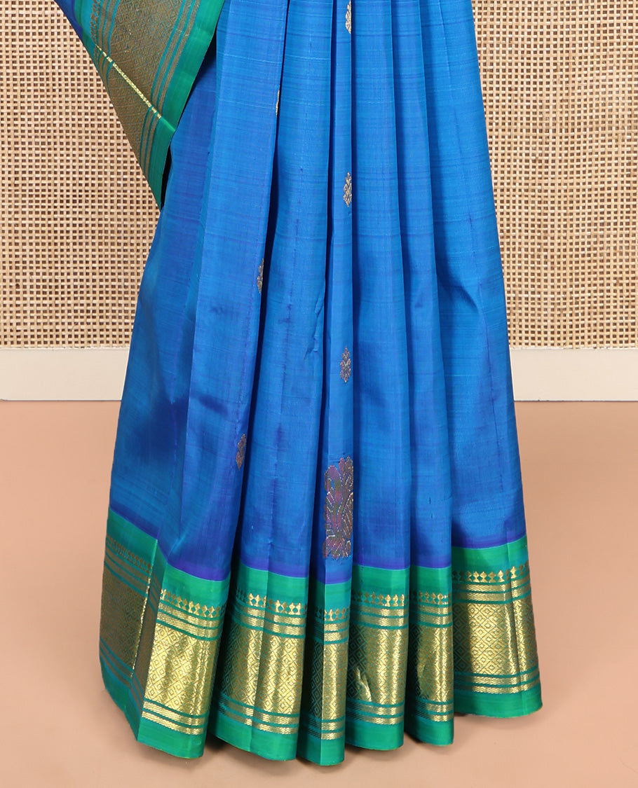 Blue Kanchipuram Silk Saree, Styled with Zari Buttas, Complemented by a Contrast One-Sided Border of Panner Sombu, Banaras, and Mayil Kann Designs, Grand Pallu, and No Blouse