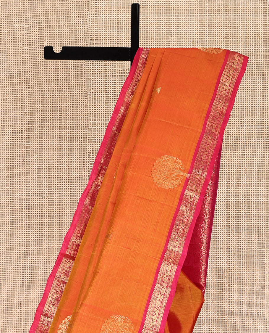 Orange Kanchipuram Silk Saree, Spotlighted with Tree Zari Buttas All Over Its Body, Complemented by a Contrast Border of Rekku, Cross Kamalam, and Kodi Visiry Designs, Intricately Designed Pallu, and Paired with a Contrast Blouse