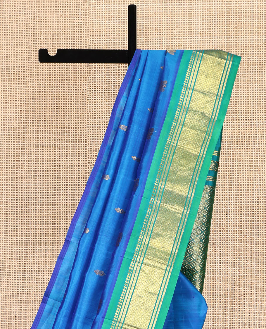 Blue Kanchipuram Silk Saree, Styled with Zari Buttas, Complemented by a Contrast One-Sided Border of Panner Sombu, Banaras, and Mayil Kann Designs, Grand Pallu, and No Blouse