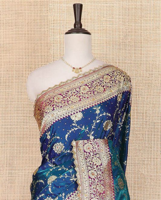 Blue Art Vastrakala Silk Saree Spotlighted with Floral Jaal Jacquard with Stone Work All Over Its Body, Complemented by a Contrast Floral Creeper Zari Stone Work Border, Intricate Pallu Detailed in Zari and Stone Work, and Paired with a Contrast Blouse
