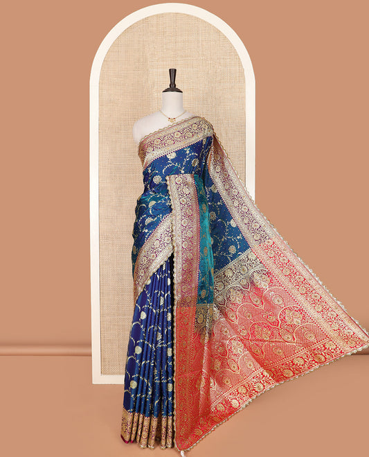 Blue Art Vastrakala Silk Saree Spotlighted with Floral Jaal Jacquard with Stone Work All Over Its Body, Complemented by a Contrast Floral Creeper Zari Stone Work Border, Intricate Pallu Detailed in Zari and Stone Work, and Paired with a Contrast Blouse
