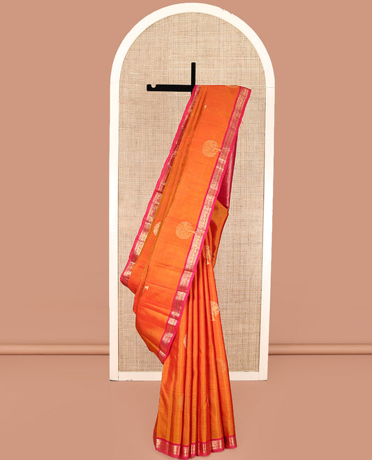 Orange Kanchipuram Silk Saree, Spotlighted with Tree Zari Buttas All Over Its Body, Complemented by a Contrast Border of Rekku, Cross Kamalam, and Kodi Visiry Designs, Intricately Designed Pallu, and Paired with a Contrast Blouse