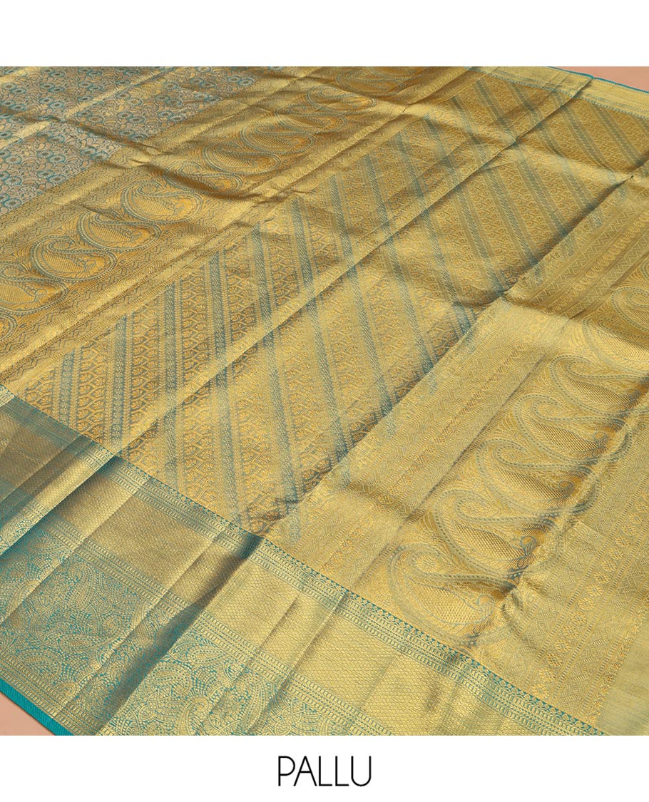 Blue Kanchipuram Silk Saree, Elegantly Highlighted with Zari Jacquard Design All Over Its Body, Highlighted by a Zari Border of Thilakam Mokku, Muthu, Mayil Kann, and Manga Designs, and Pallu of Mughal-Style Designs, and Paired with a Matching Blouse