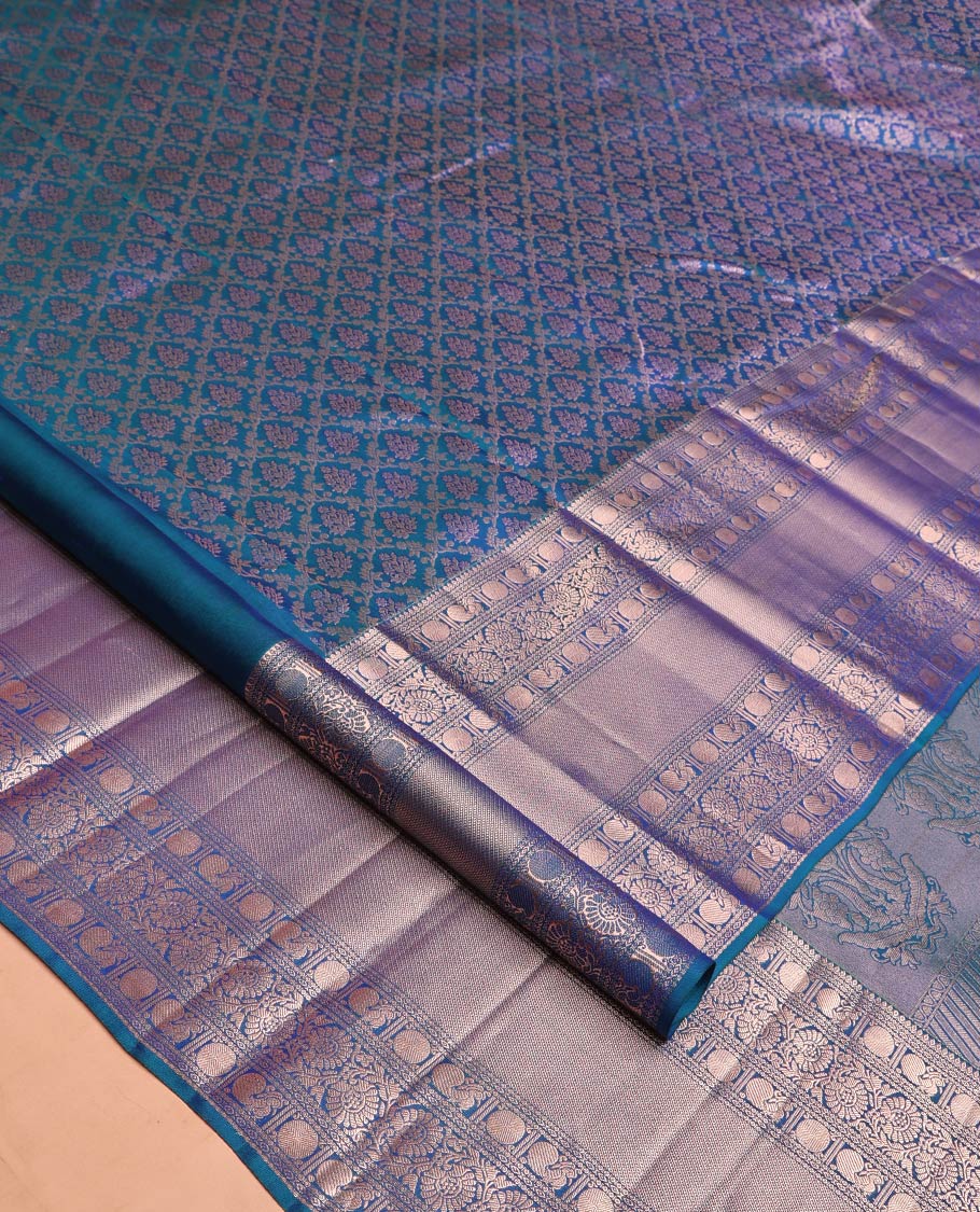 Blue Kanchipuram Wedding Silk Saree, Detailed with Jacquard Design on Its Body, Highlighted by Zari Border of Thilakam, Kodi Visiry, Mayil, and Poun Designs, Grand Pallu, and Paired with a Matching Blouse