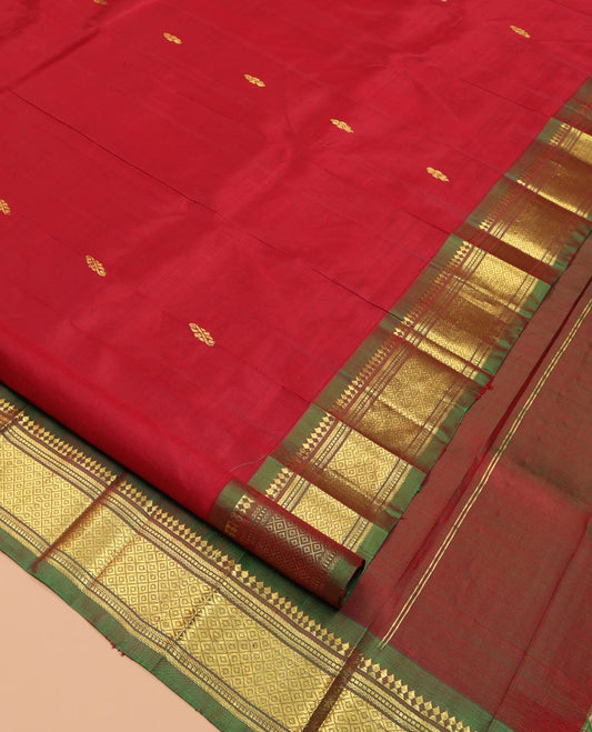 Maroon Zari Buttas Kanchipuram Silk Saree, Complemented by a Contrast One-Sided Border of Panner Sombu, Banaras, Muthu, and Jaal Designs, Zari Design Pallu, and a No Blouse