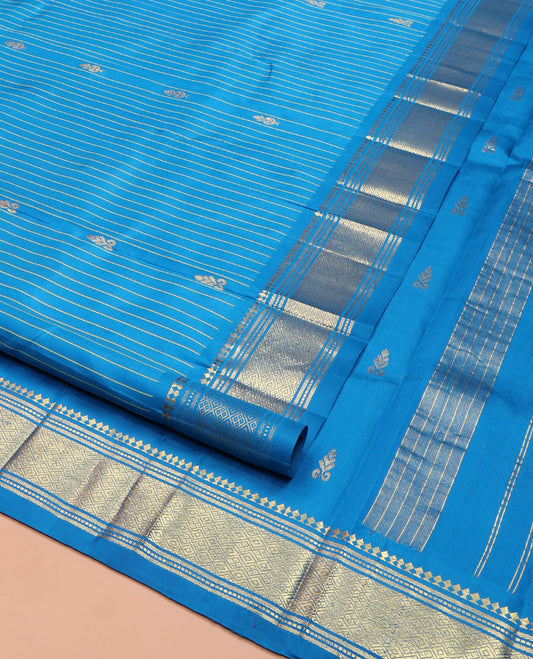 Blue Kanchipuram Silk Saree, Beautified with Zari Buttas and Stripes on Its Body, Highlighted by a Zari One-Sided Border of Panner Sombu, Banaras, and Jaal Designs, Pallu Features Zari Designs, and Comes Without a Blouse