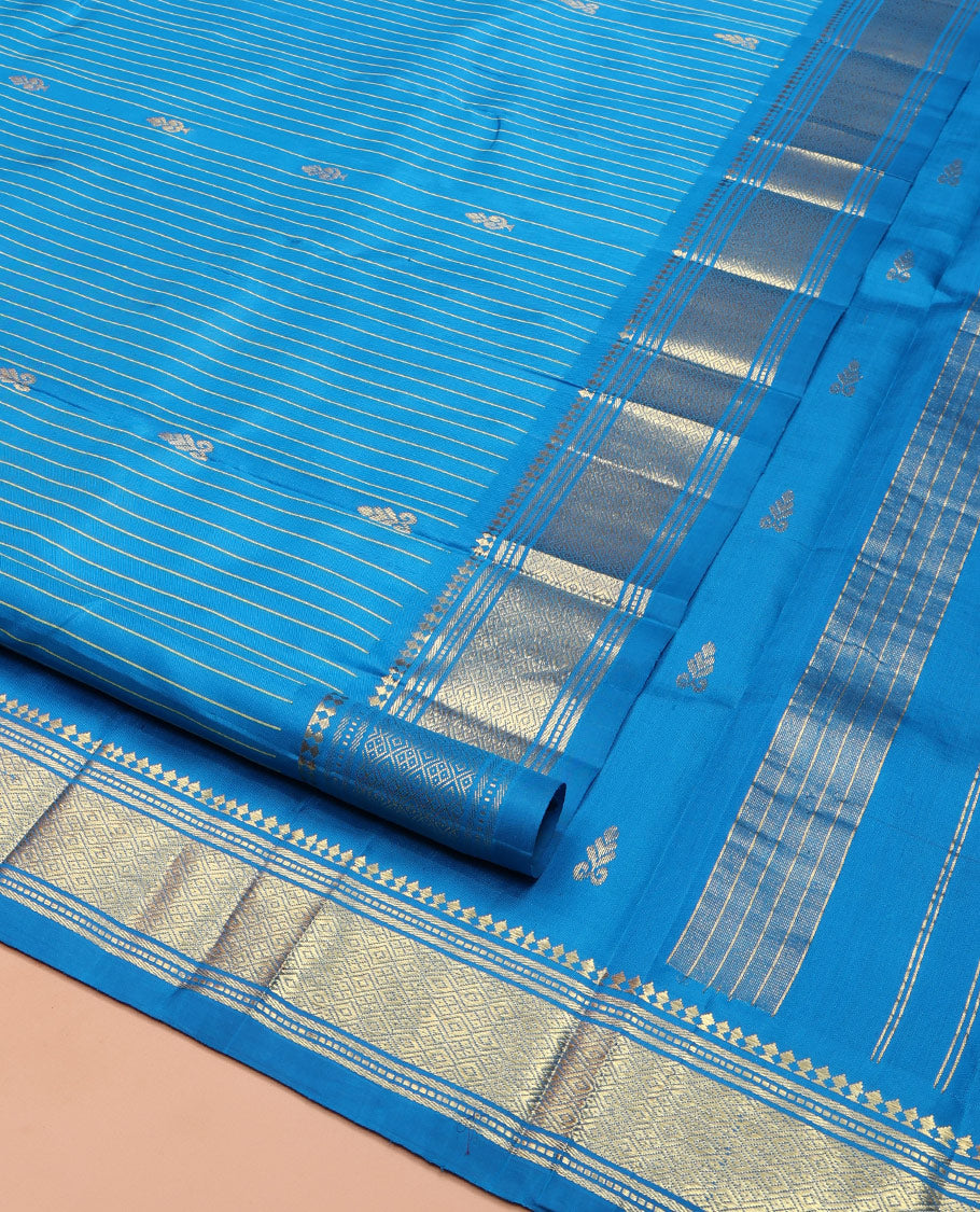 Blue Kanchipuram Silk Saree, Beautified with Zari Buttas and Stripes on Its Body, Highlighted by a Zari One-Sided Border of Panner Sombu, Banaras, and Jaal Designs, Pallu Features Zari Designs, and Comes Without a Blouse