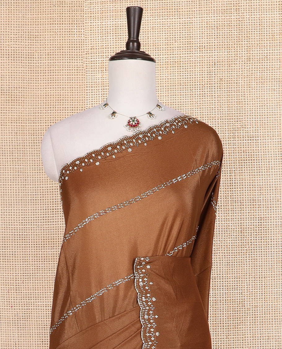 Brown stone and tube bead embroidered designer saree, scallop stone and kardana embroidered border