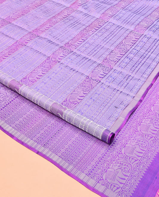 Lavender Mayuri Soft Silk Saree, Meticulously Crafted with Traditional Motifs in Embossed Weave, Subtle Border, Pallu of Geometric Patterns, and Paired with a Matching Blouse
