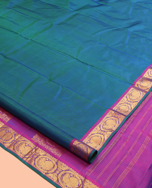 Blue Kanchipuram Silk Saree, Elevated with Vazhaipoo Stipes and Zari Buttas, a Contrast Traditional Mayil Motif Border, Pallu of Zari Design, and Contrast Blouse