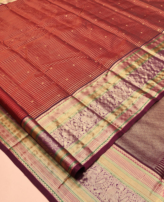 Maroon Vasundhara Lite Silk Mix Saree, Adorned with Zari Butta Enclosed Checks, a Zari Border of Rekku, Kuyil Kann, and Mayil Designs, Grand Pallu, and a Matching Blouse