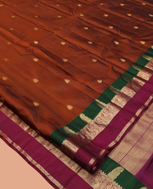 Rust Vasundhara Lite-Silk Mix Saree, Graced with Zari Buttas, Complemented by a Contrast Rettai Pettu Border of Manga, Mayil, Kamalam, and Muthu Designs, Grand Pallu, and a Contrast Blouse