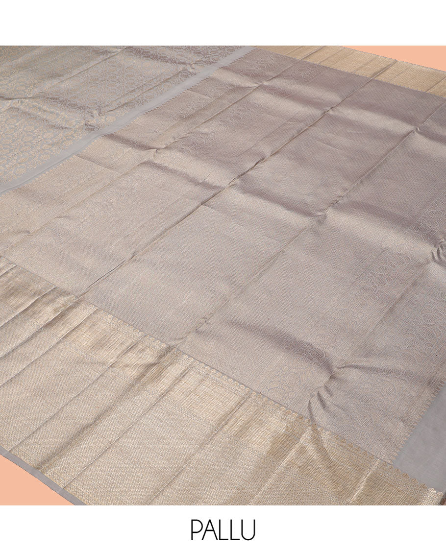Grey Kanchipuram Wedding Silk Saree Features Jacquard Design, a Zari Border of Thilakam Mokku, Vanki, and Jaal Designs, Grand Pallu, and a Matching Blouse