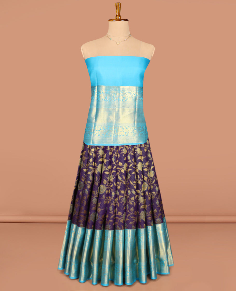 Violet Pure Silk Half-Saree, Gracefully Embellished with Floral Jacquard All Over Its Skirt, Complemented by a Contrast Border of Mayil, Yaanai, Mayil Kann, and Jaal Designs, Paired with a Contrast Blouse, and Comes with a Zari Design Dhavani