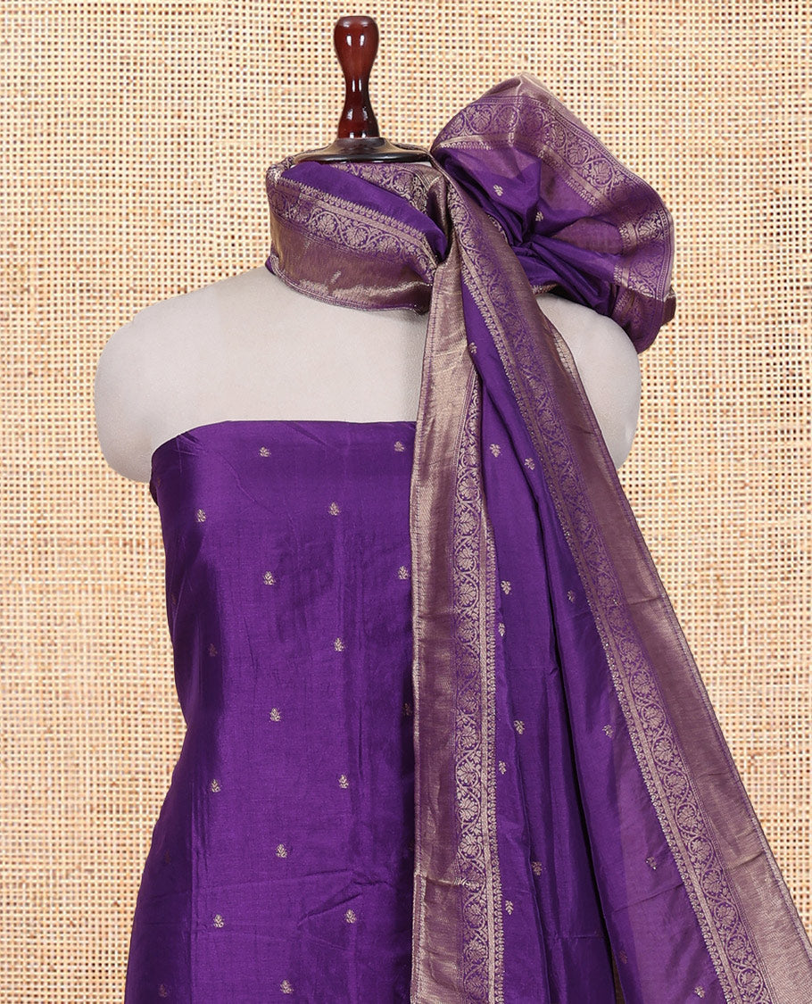 Purple Semi-Silk Material Churidar Features Zari Buttas Woven Top, a Santoon Bottom, and Zari Design Dupatta