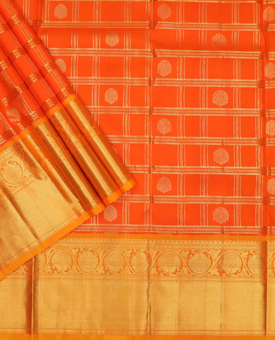 Orange pure-silk half-saree, zari buttas and checked skirt, contrast kodi visiry border, zari design blouse, and a intricate zari woven dhavani
