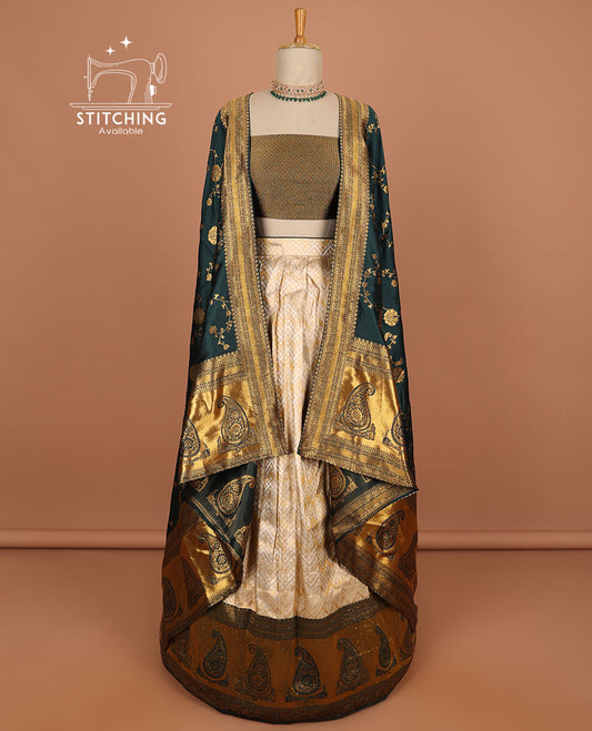 Cream geometric design half saree with contrast zari border, zari design blouse & green floral zari design dhavani