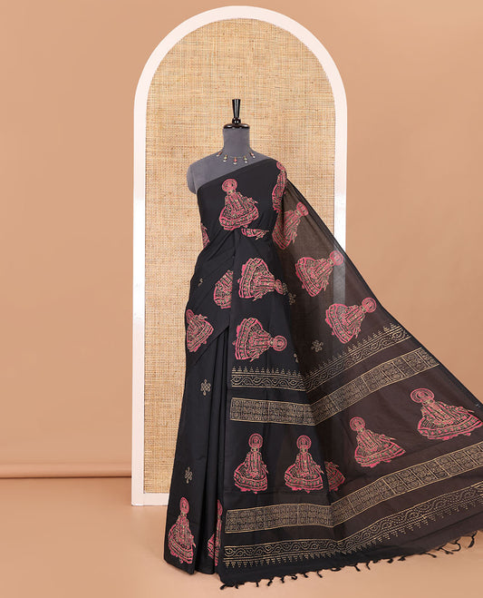 Borderless black kolam and kathakali motifs printed South cotton saree with a matching blouse, and a contrast floral-peacock vine printed blouse