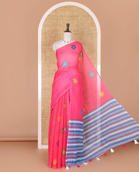 Borderless pink colorful five-petal flower motifs printed linen cotton saree, multi-color striped pallu, and contrast printed blouse