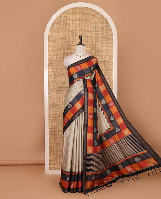 Chikku-black plain kathan silk saree, contrast buttas enclosed multi-color checked blocks border, temple pallu, and contrast blouse of checks, and buttas