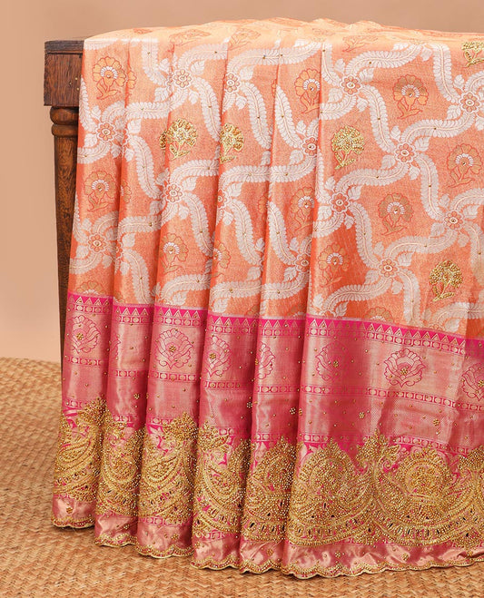 Orange floral jacquard vastrakala silk saree with stone work, contrast floral stone work scallop border & floral design in stone work pallu
