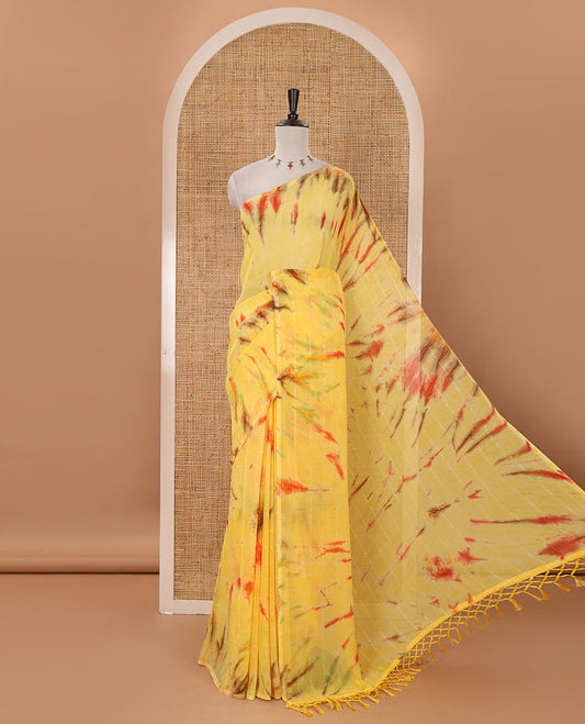 Borderless yellow shibori-style printed & sequins work marble chiffon saree, self-pallu with tassels & contrast embroidered blouse