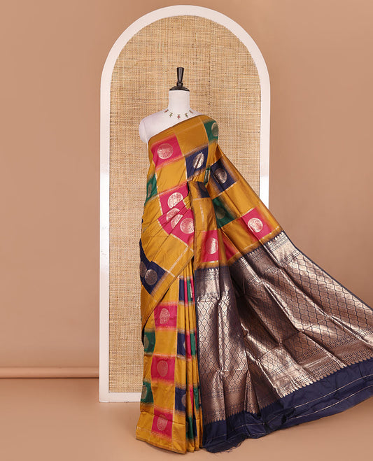 Borderless mustard chakra buttas enclosed, checked elite soft silk saree, contrast ogee patterned pallu, and contrast zari design blouse