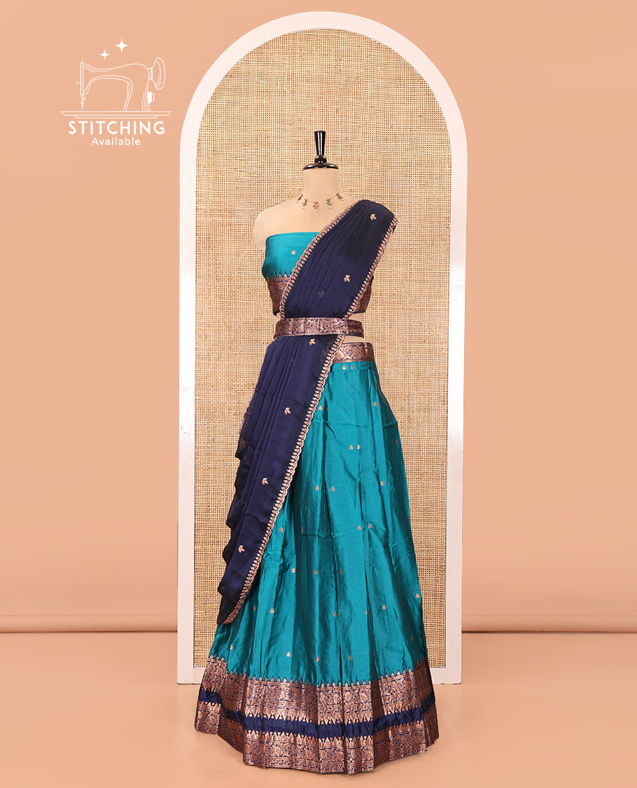 Rama Green and Blue Semi-Banarasi Half-Saree, Accentuated with Zari Buttas on Its Skirt, Complemented by a Contrast Rettai Pettu Traditional Zari-Design Border, Paired with a Matching Blouse, and Comes with a Contrast Satin Georgette Embroidered Dhavani