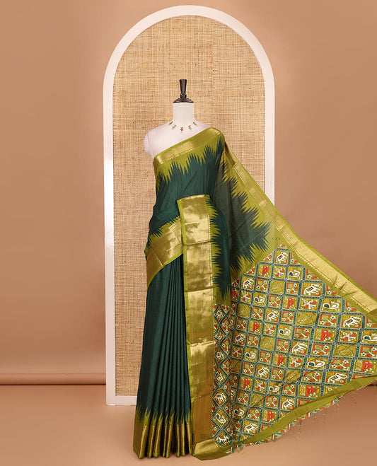 Green plain dola-tussar saree, contrast temple zari border, patola animal motifs enclosed jaal printed pallu & patola printed blouse