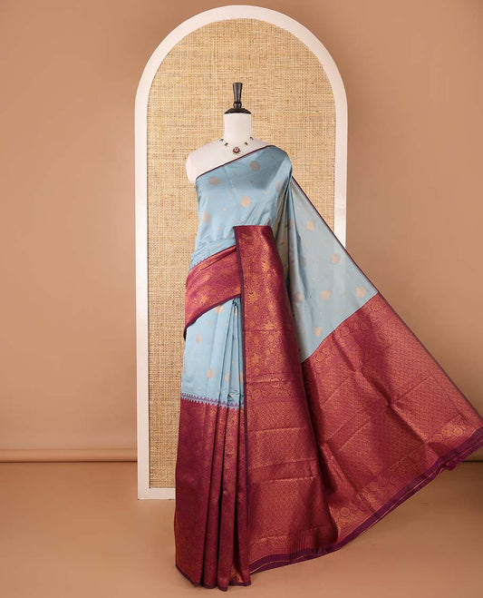 Borderless grey-purple zari buttas & half-&-half vanasingari-style flora-fauna woven kanchi silksaree,self-pallu & blue blouse of zari brocade
