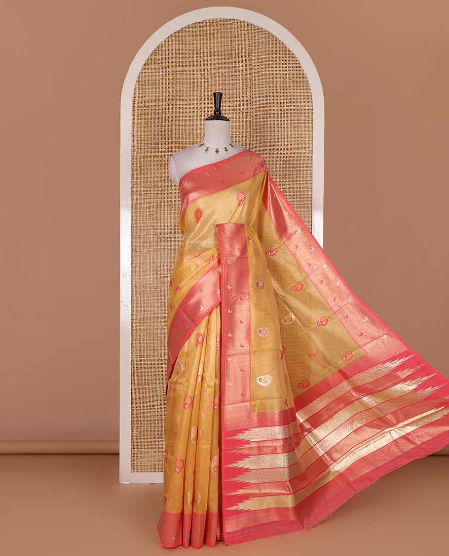 Yellow antique buttas tissue silk saree, contrast satin zari border of half-moon motifs, pallu of temple design pallu, and contrast butta blouse