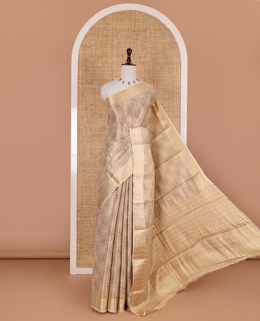 Chikku scallop design tissue saree, zari striped border, striped pallu, and gleaming matching blouse