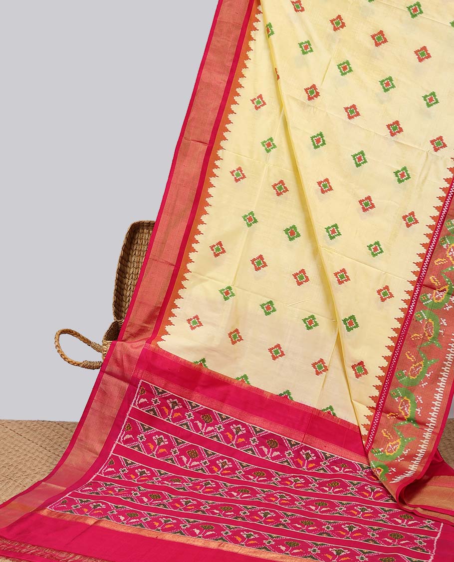 Yellow with motifs ikkat silk saree, contrast peacock border &  floral design pallu