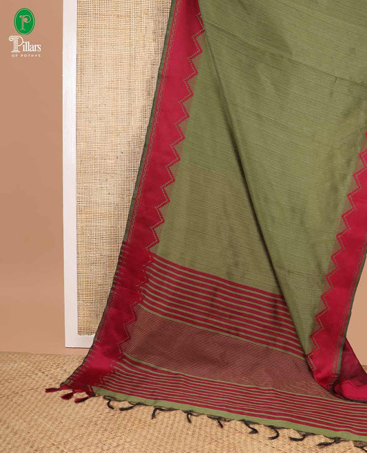Green banarasi jute silk saree with contrast temple border & striped pallu along with contrast blouse