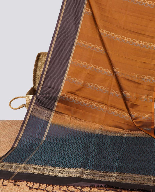 Brown intricate design soft silk saree with contrast striped border & leaf design pallu