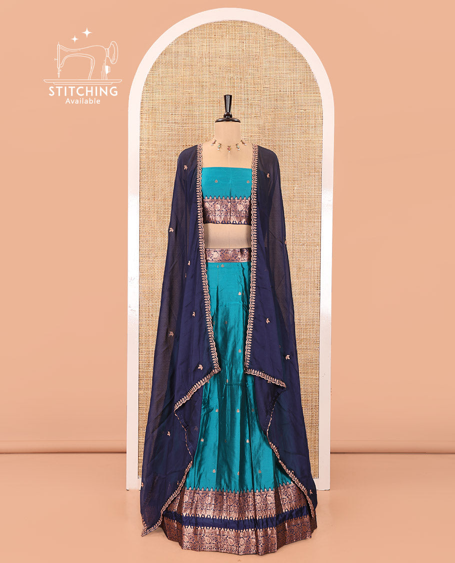 Rama Green and Blue Semi-Banarasi Half-Saree, Accentuated with Zari Buttas on Its Skirt, Complemented by a Contrast Rettai Pettu Traditional Zari-Design Border, Paired with a Matching Blouse, and Comes with a Contrast Satin Georgette Embroidered Dhavani