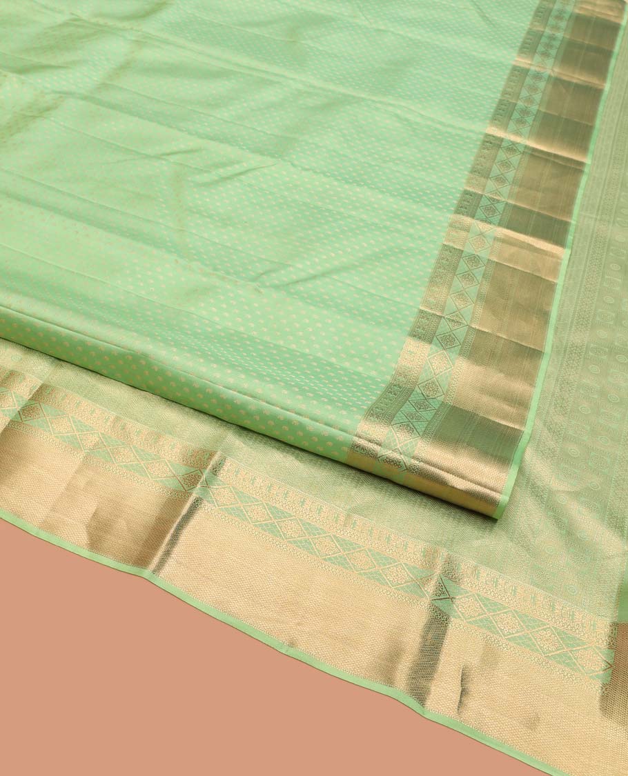Green Vasundhara Silk Saree, Steeped with Zari Buttas on Its Body, Highlighted by a Zari Border of Traditional Designs, Richly Woven Jaal Pallu, and Paired with a Matching Blouse