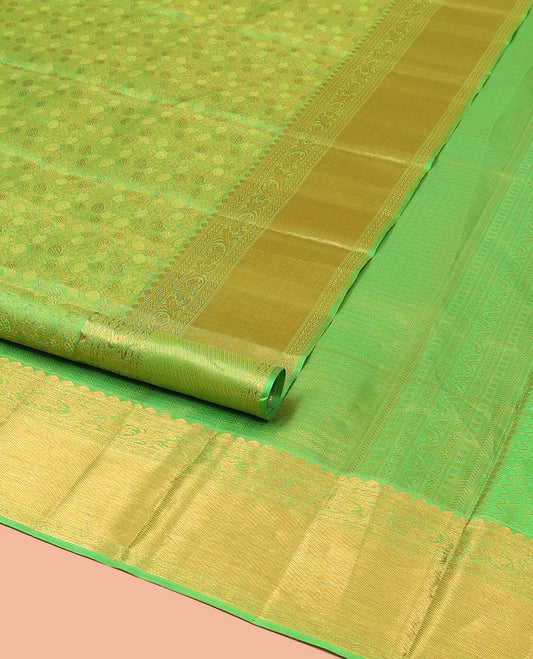 Green Kanchipuram Wedding Silk Saree, Artfully Detailed with Jacquard Designs on Its Body, Highlighted by a Zari Border of Thilakam, Rettai Neli, and Kodi Visiry Designs, Gracefully Embellished Pallu, and Paired with a Matching Blouse