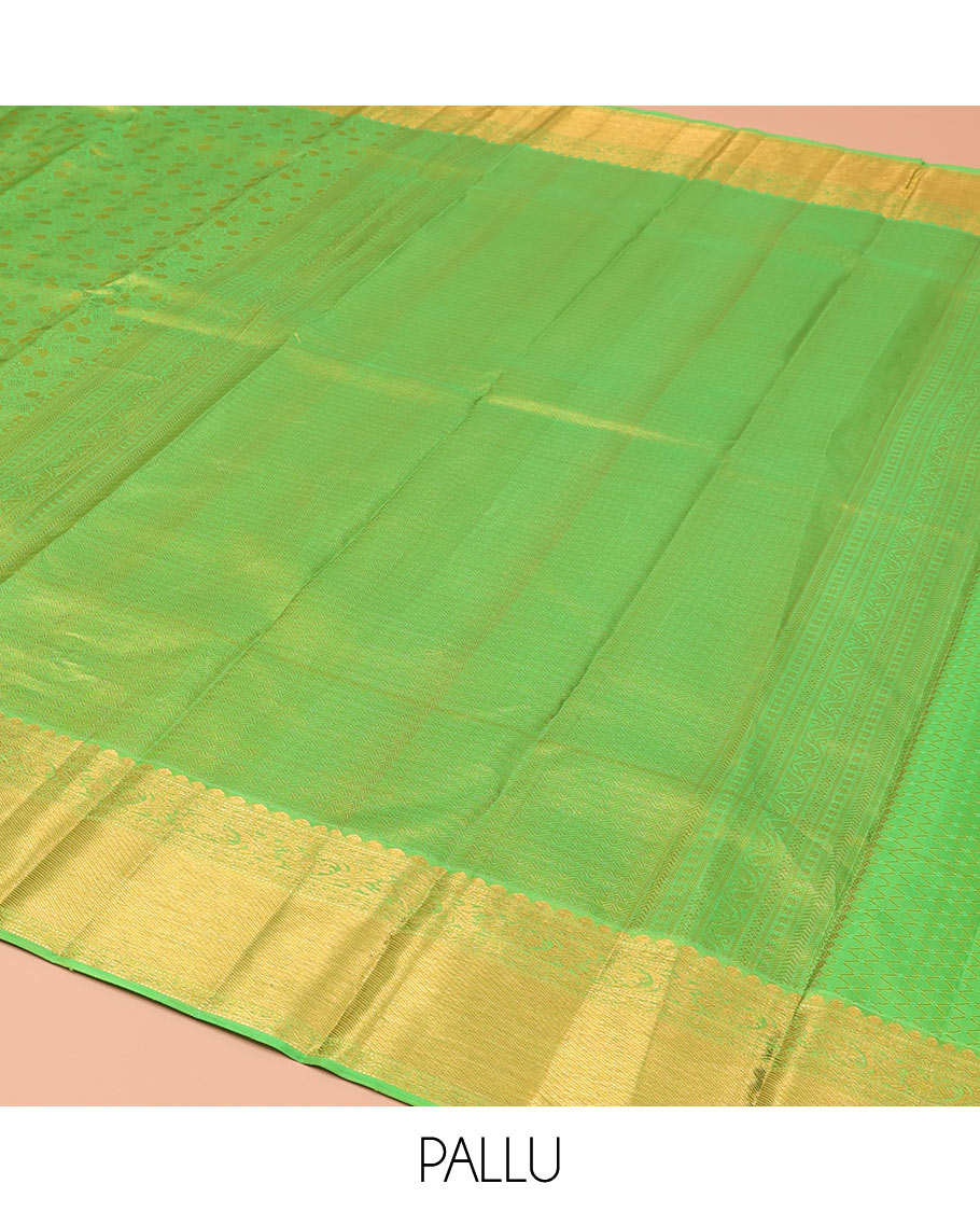 Green Kanchipuram Wedding Silk Saree, Artfully Detailed with Jacquard Designs on Its Body, Highlighted by a Zari Border of Thilakam, Rettai Neli, and Kodi Visiry Designs, Gracefully Embellished Pallu, and Paired with a Matching Blouse