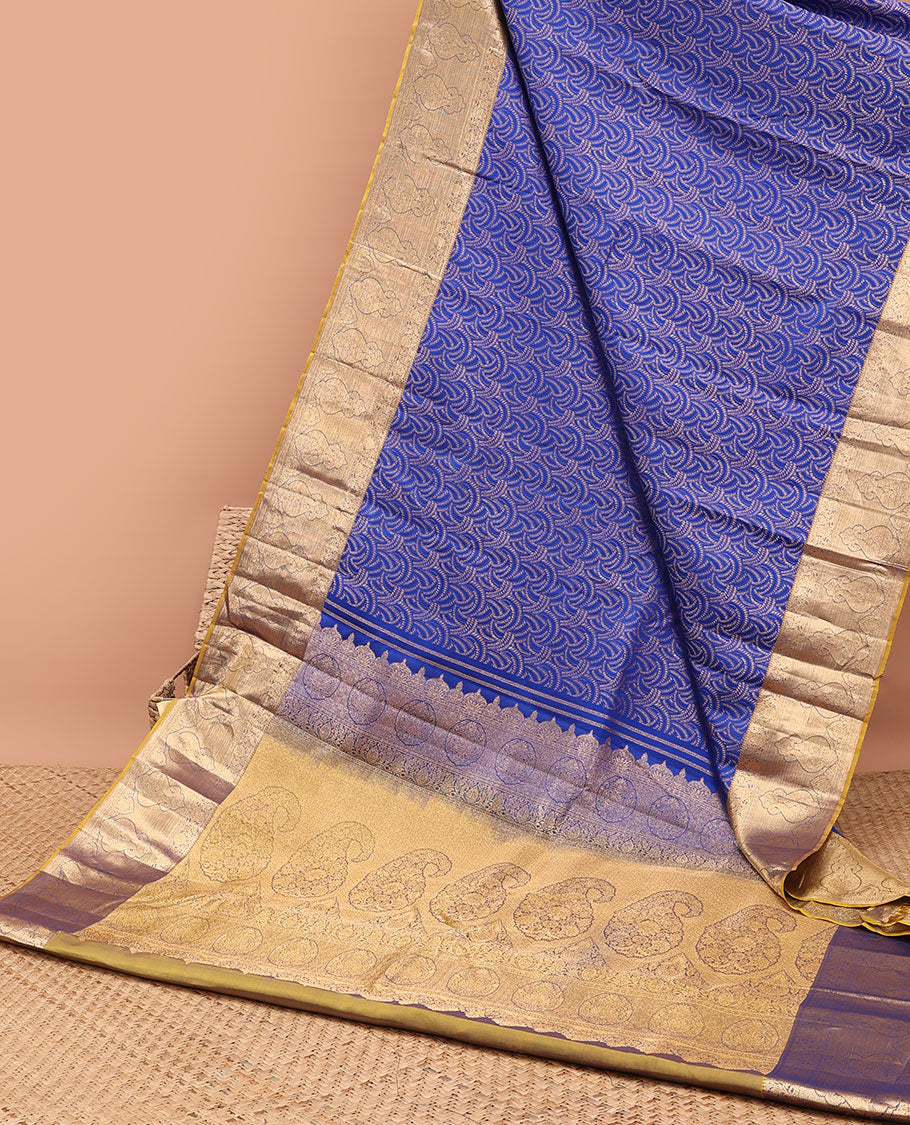 Blue geometric kancheepuram silk saree with contrast floral zari border & paisley design pallu