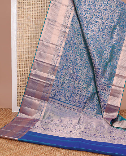Dark blue floral kancheepuram silk saree with self border of rekku, muthu, banaras & zari design pallu