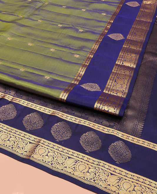 Olive Green Vasundhara Lite Silk Mix Saree, Mesmerized with Zari Buttas, Complemented by a Contrast Border of Muthu, Banaras, Rudraksham, and Mayil Designs, Pallu Elevated with Rudraksham Butta Enclosed Jaal Designs, and Paired with a Contrast Blouse