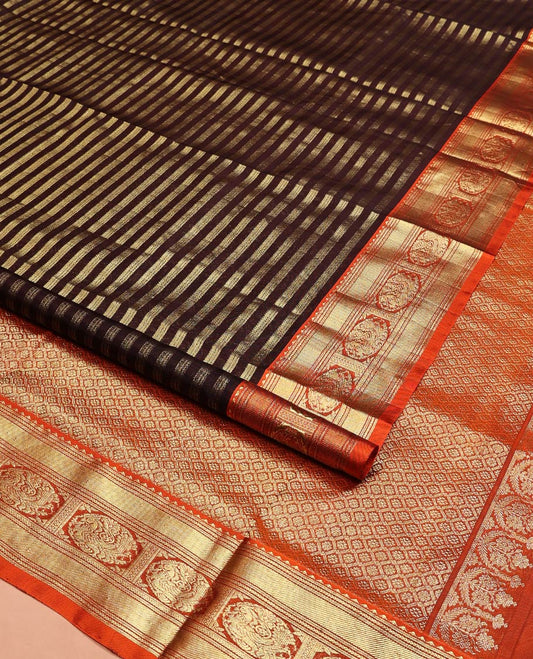 Brown Venkatagiri Silk Saree, Bedecked with Zari Stripes All Over Its Body, Complemented by a Contrast Traditional Zari Border of Round Peacock Designs, Jaal Design Pallu, and Paired with a Contrast Blouse