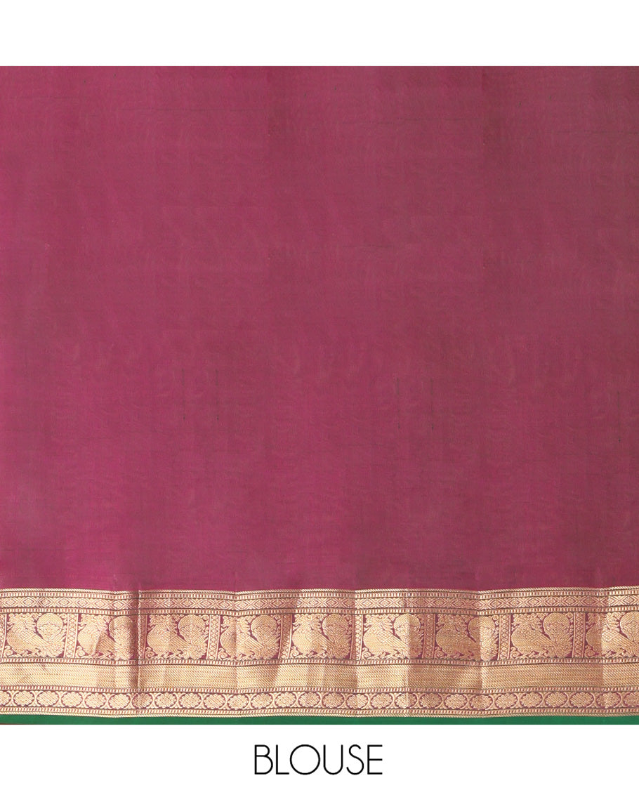 Green Kanchipuram Silk Saree, Beautified with Mayil Buttas and Zari Stripes on Its Body, Complemented by Contrast Border of Muthu, Diamond, Mayil, and Laddu Kamalam Designs, Diagonally Striped Pallu, and Paired with a Contrast Blouse