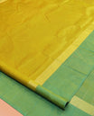 Green Kanchipuram Silk Saree, Woven with Floral Zari Buttas, a Contrast Floral Zari Design Border, Floral Design Pallu, and a Contrast Blouse