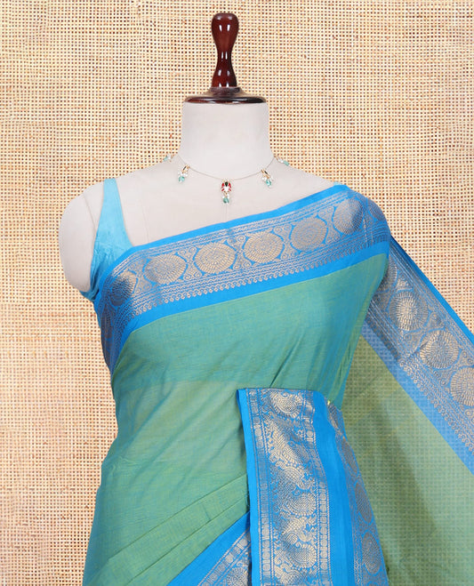 Sea Green Plain Chettinad Cotton Saree, Complemented by a Contrast Traditional Zari Rettai Pettu Border, and a Matching Blouse
