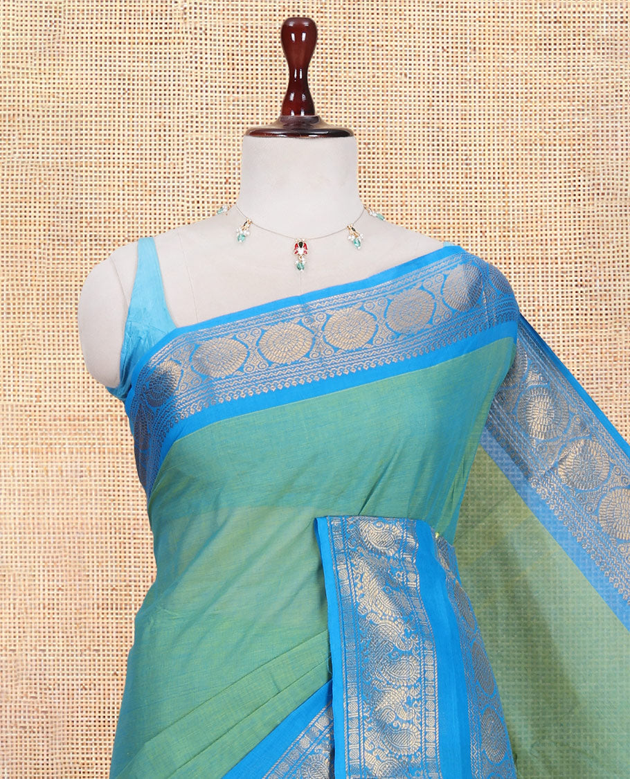 Sea Green Plain Chettinad Cotton Saree, Complemented by a Contrast Traditional Zari Rettai Pettu Border, and a Matching Blouse