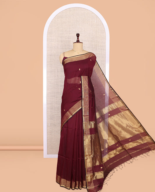 Maroon Maheshwari Cotton Saree, Bedecked with Buttas, Highlighted by a Traditional Zari Border, Zari Gleamed Up Pallu, and a Matching Blouse